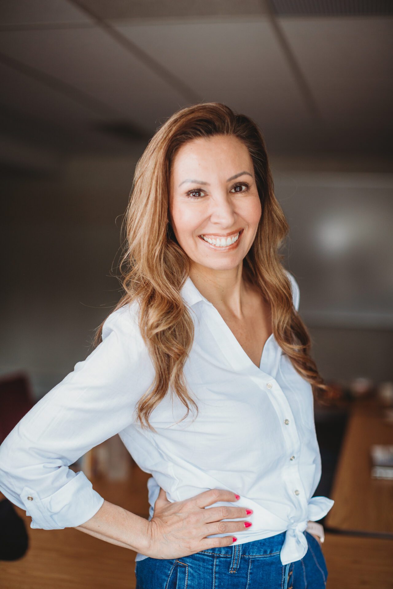 Darla Headshot in a Boardroom